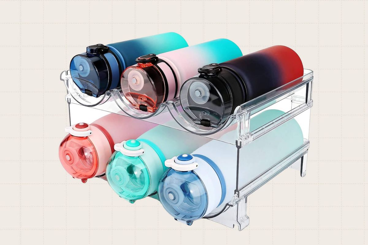 The Spospo Water Bottle Organizer, a clear, acrylic organizer that holds six water bottles and can fit inside a kitchen cabinet for easy storage.