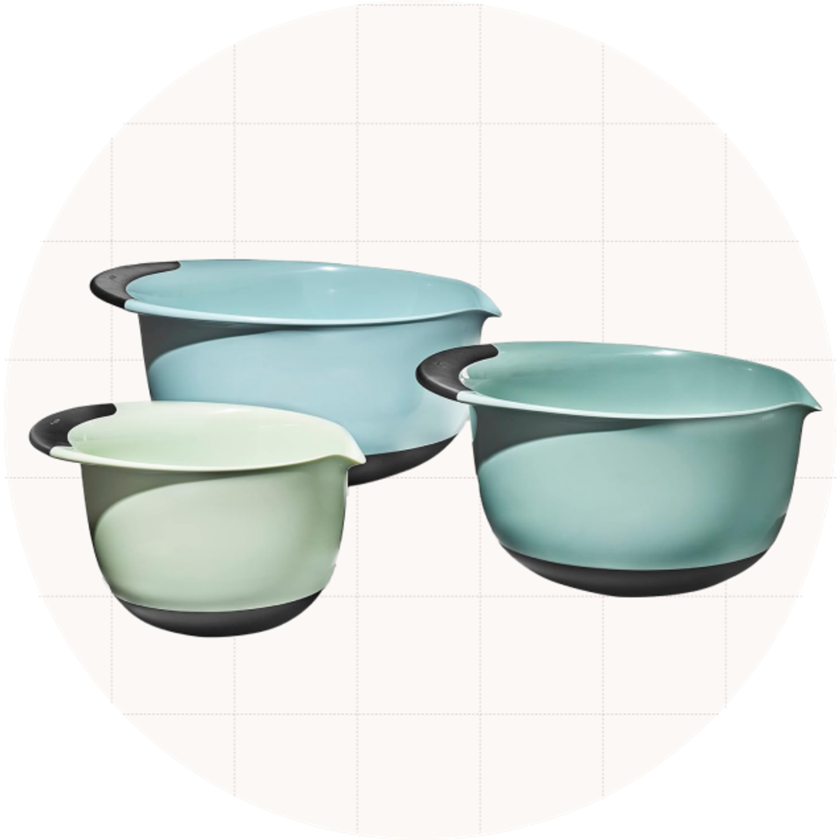 The OXO Good Grips Three-Piece Plastic Mixing Bowl Set shown in the blue colorway, which includes three different shades of light blue/green.