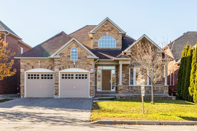 Two-story, two-garage brick home