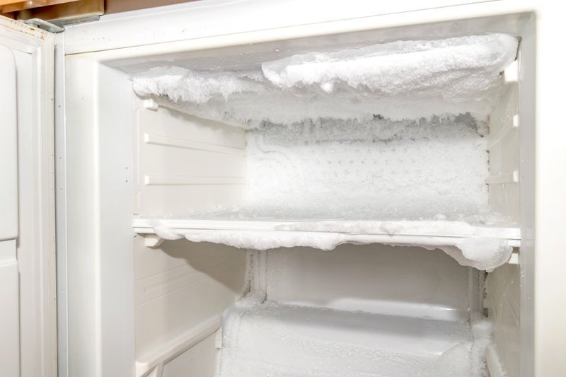 Open freezer with ice build up
